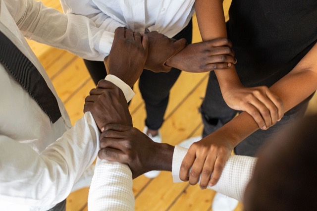 Hands joined in a circle, representing the Elim Circle community